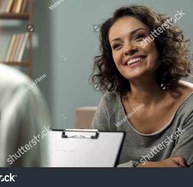 stock-photo-young-happy-lady-talking-with-psychologist-at-clinic-session-of-rehab-therapy-1204439644